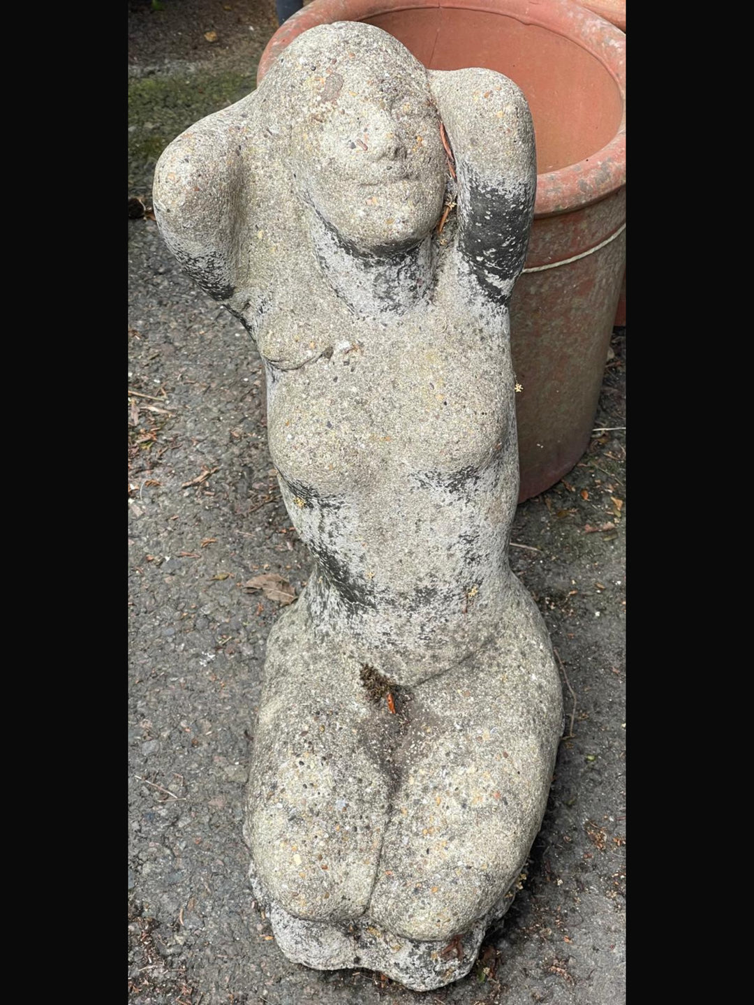 Cast stone weathered female statue