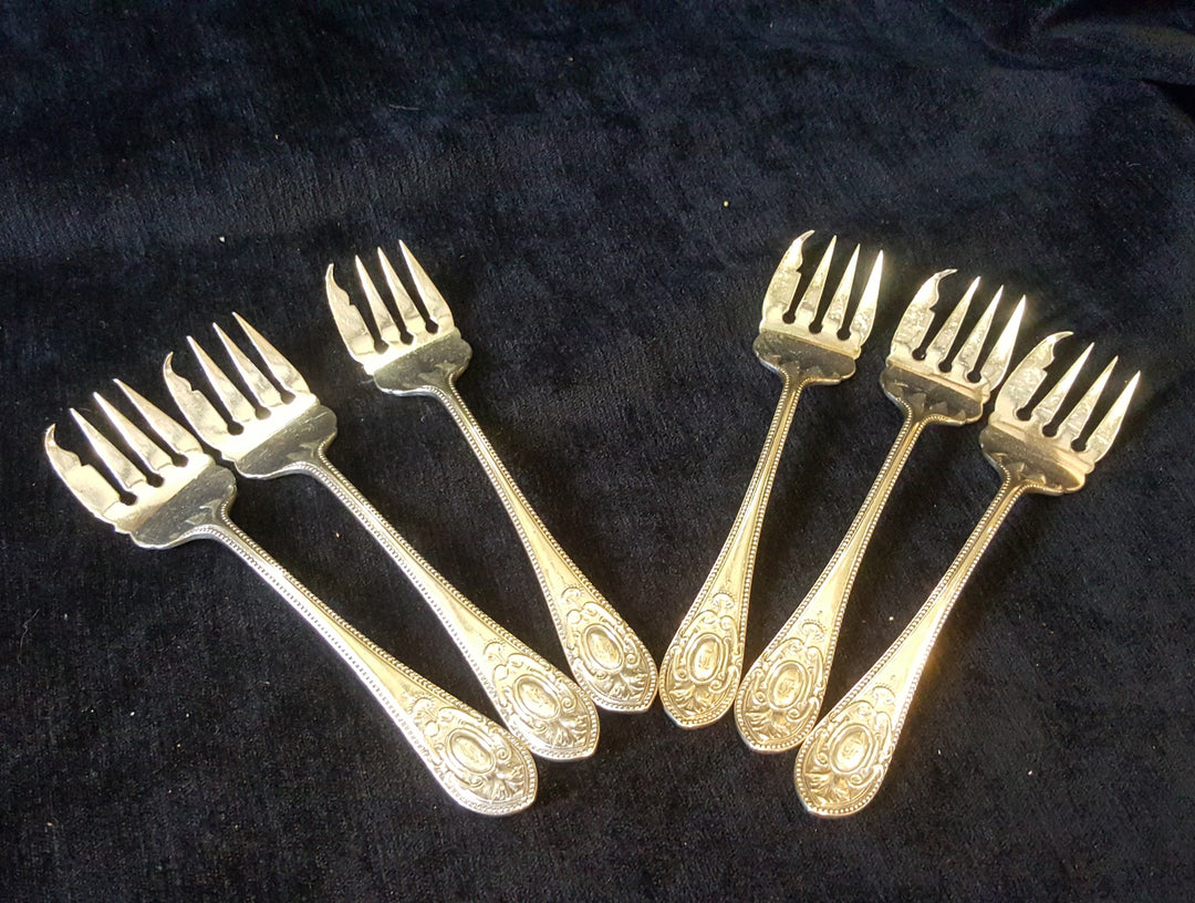 Silver Plated Oyster Forks.